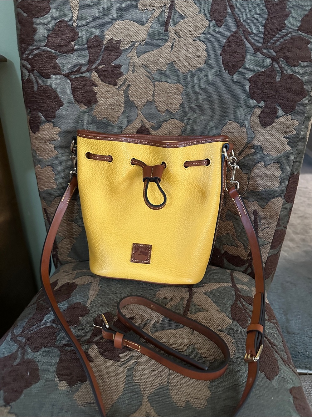 Dooney & Bourke Yellow Pebbled Leather Drawstring Crossbody with Brown Trim